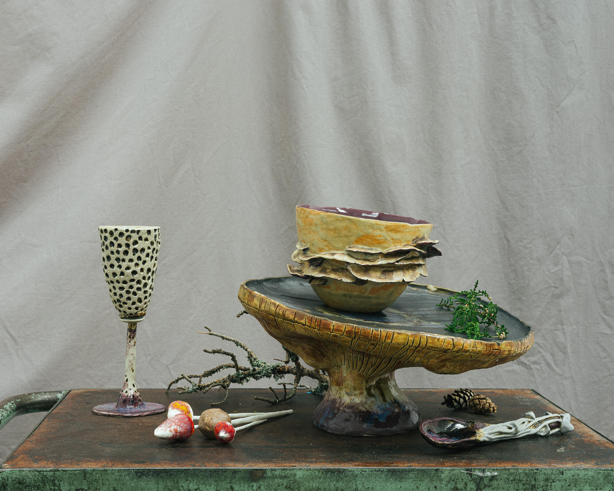 forest inspired table set, with a bowl, glass and a spoon
